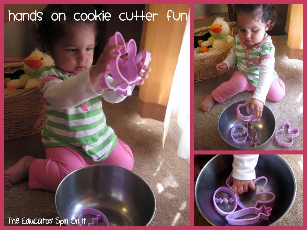 toddler playing with easter themed cookie cutters in metal bowl 