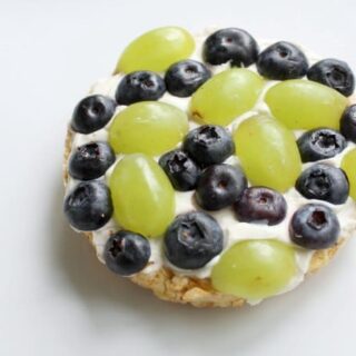 Healthy Earth Day Fruit Snack for Kids with Grapes and Blueberries on Rice Cake