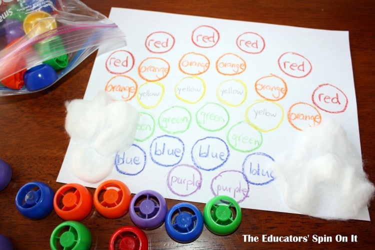 Circles with color words written with colorful recycled lids for learning color words