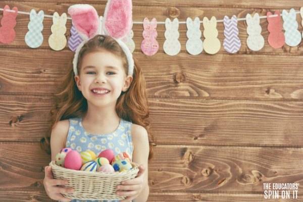 Child with Easter eggs and bunny themed bunting