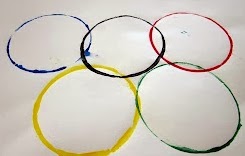 Make the Olympic rings with circle prints and paint