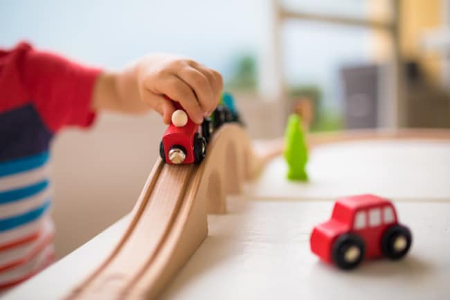 Child Playing with Train