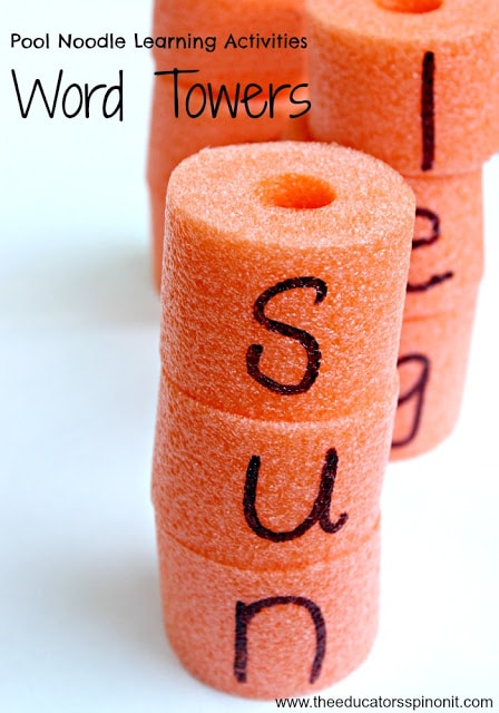 letters written on pool noodles to create a word tower