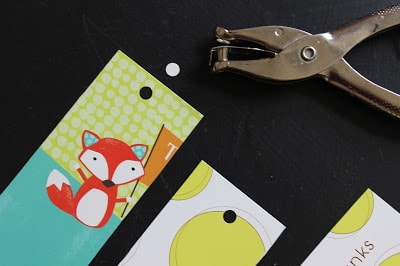 hole punch the top of the cut bookmark