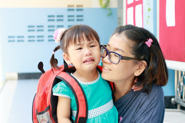 Child anxious about the first day of school, parenting comforting