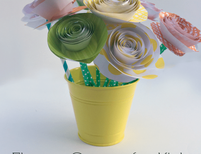 Colorful spiral paper flowers in yellow pot made by kids