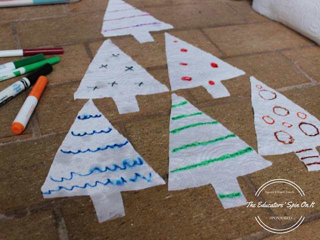 Let the child add ornaments to the tree with different colored markers.  Try a variety of lines, circles, and waves.