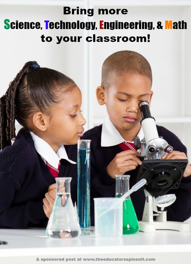 2 kids using a microscrope in an elementary school classroom