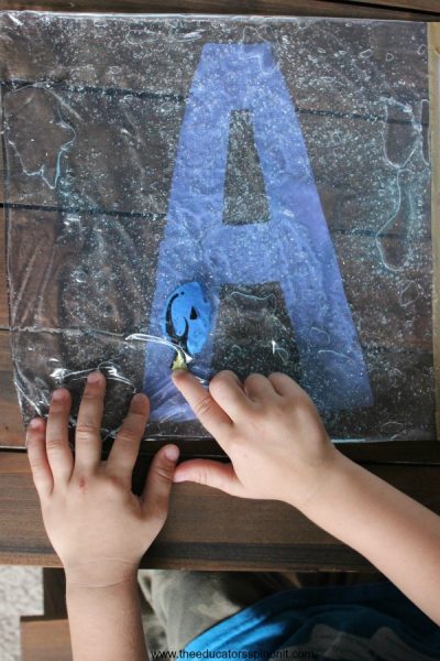 Child learning their Alphabet with hands-on Swimming Letters with Dory Sensory Bag