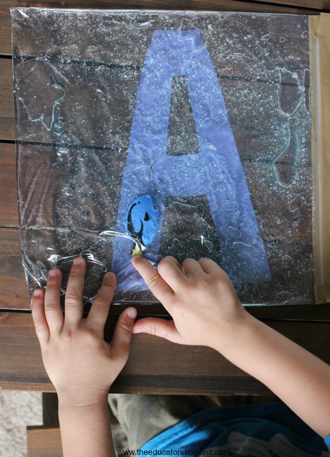 Child learning their Alphabet with hands-on Swimming Letters with Dory Sensory Bag