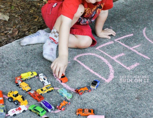 Zoom and Learn, a FUN & EASY literacy activity for preschoolers. Get learning outside with this alphabet car activity for kids.