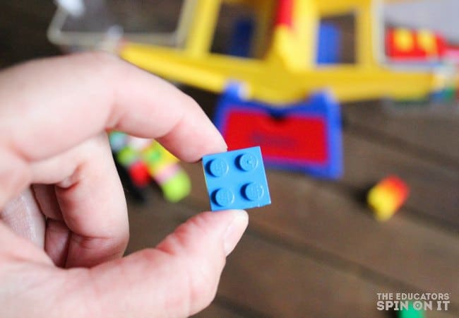 Sorting bricks by size. 2x2 LEGO brick in hand.