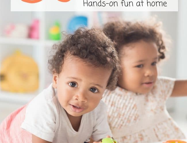 2 Toddlers Playing at White Table with Toddler Toys on Bookcase