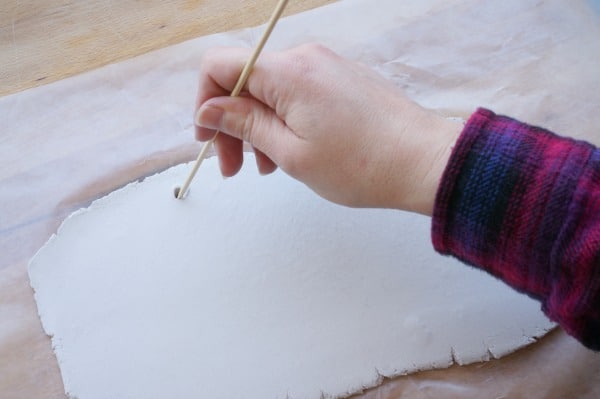 making holes in clay sign