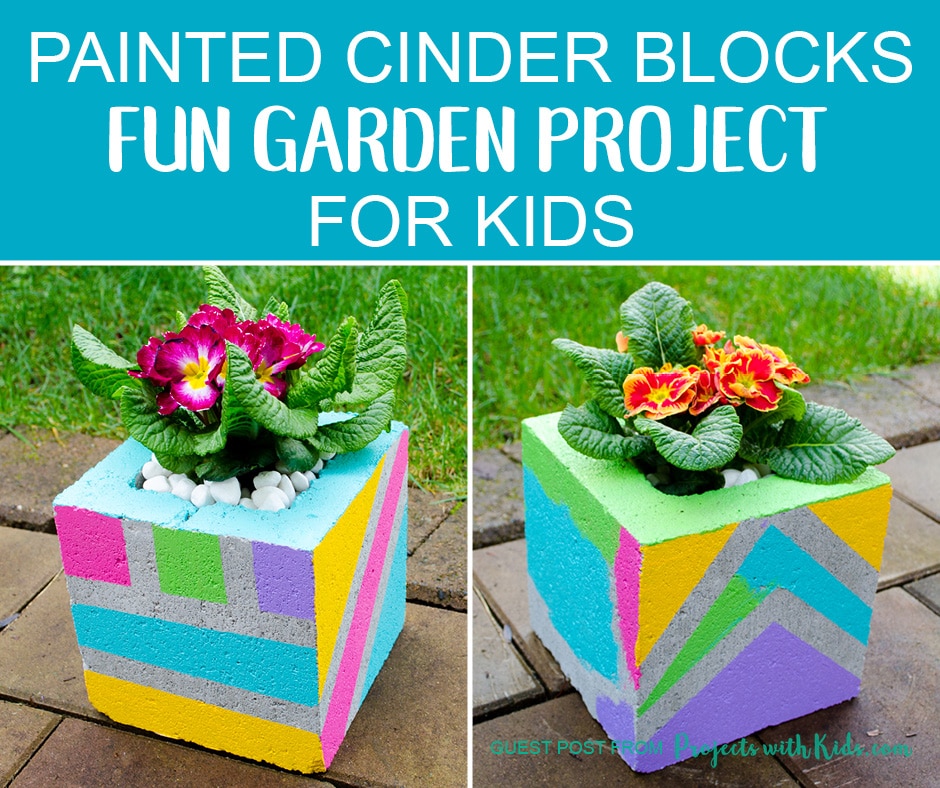 Flowers planted in colorful cinder blocks painted by kids