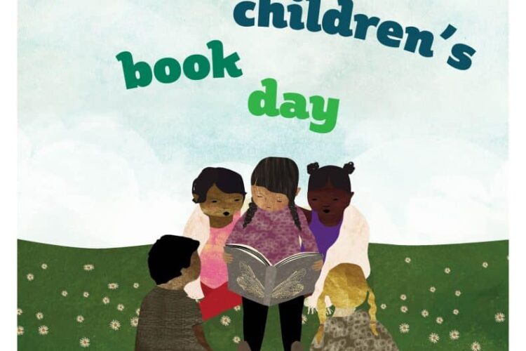 Multicultural Children's Book Day with children reading a book in group on grass with blue sky.