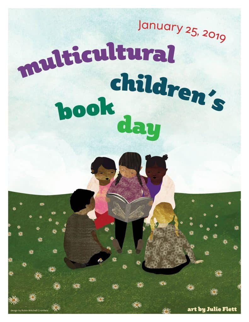 Multicultural Children's Book Day with children reading a book in group on grass with blue sky.