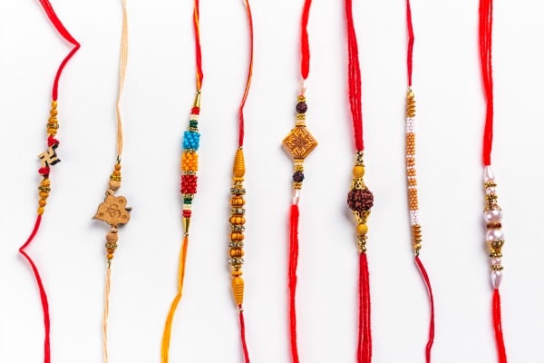 Several Rakhi bracelet with red threads and beads for Raksha Bandhan 