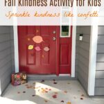 Front door covered with leaves for random act of kindness in fall
