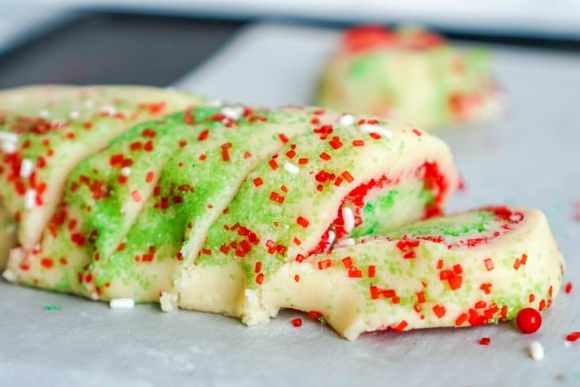 Making Christmas roll sugar cookies with sprinkles