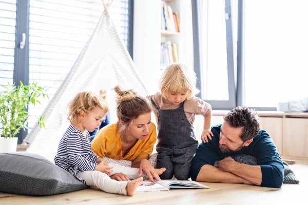 Family reading with tent 
