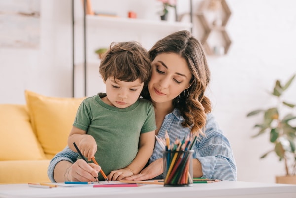 work from home mom drawing with son
