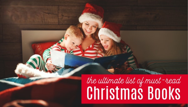 mom reading christmas book to children with santa hats on