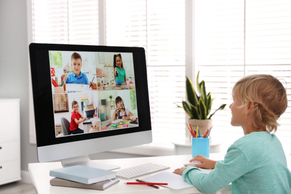 Child on virtual meeting with friends for playdate