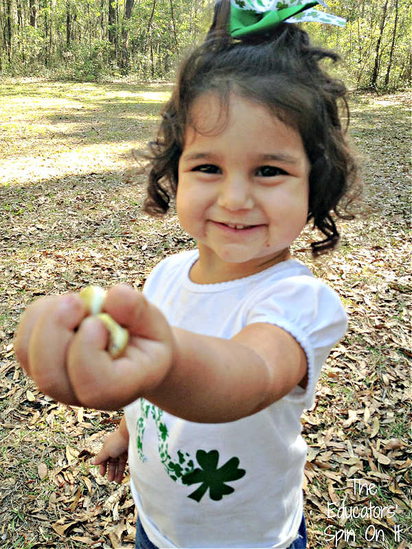 Child holding Gold from St. Patrick's Day Tot School Activities