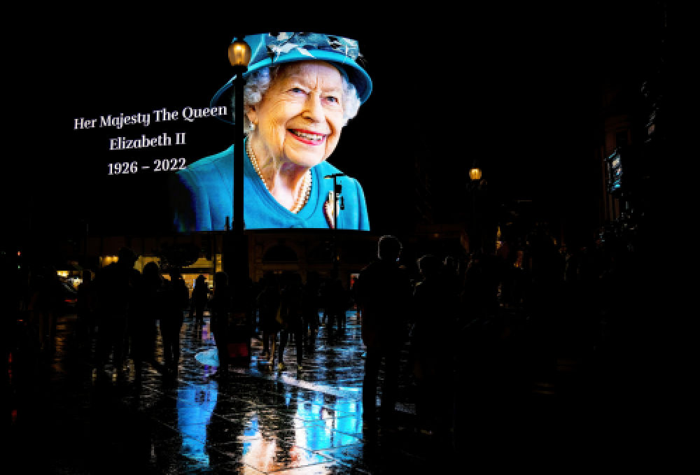 Her Majesty the Queen on Picadilly circus just after the announcement of her death, London