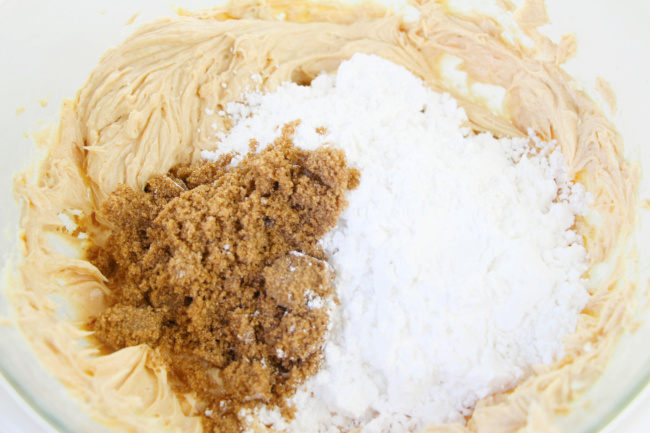 Adding sugar to Monster Cookie Dough Dip Recipe