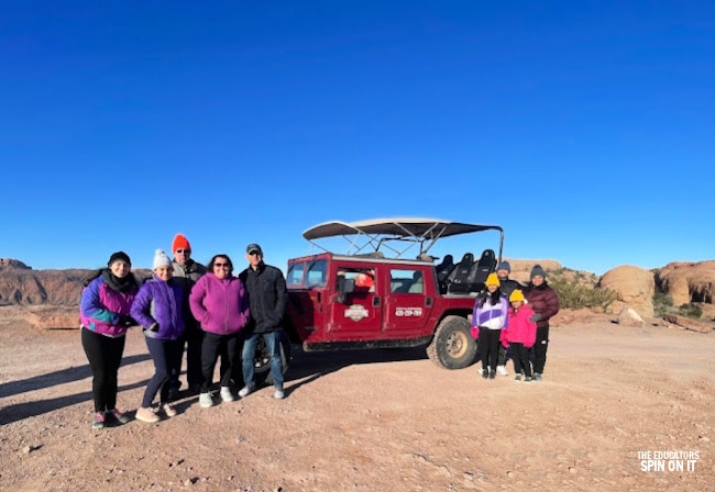 Group tours with Moab Adventure Center on the Hells Revenge Trail with Hummer H1 near dinosaur tracks