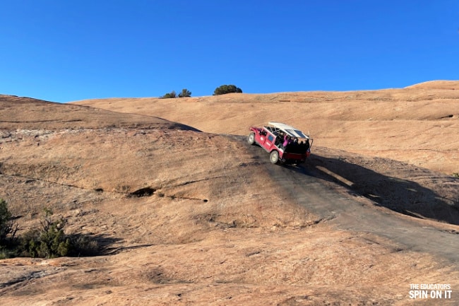 Hummer Climbing up Sandstone on the Slickrock Hummer Safari Moab Utah