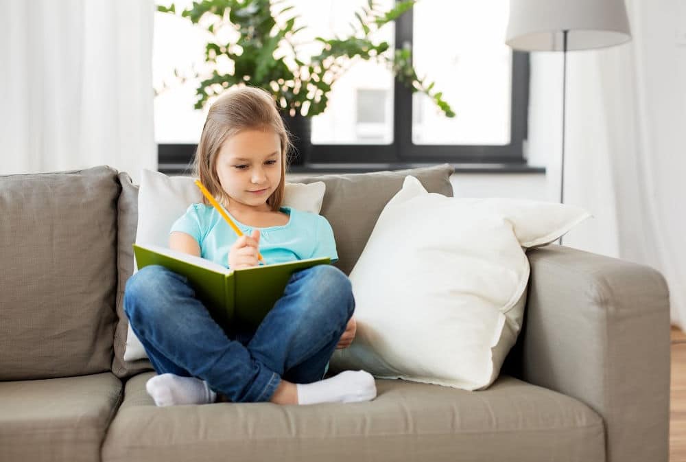 Elementary School Child Doing After-School Activities at Home