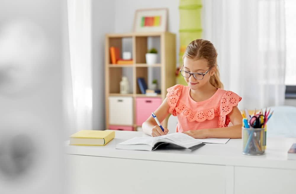 Elementary School Child Doing After-School Activities at Home 