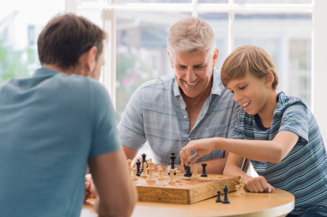 Grandparents playing board games with kids